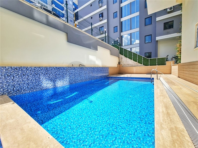 Затишна квартира 2 + 1 в сучасному комплексі в Махмутларі