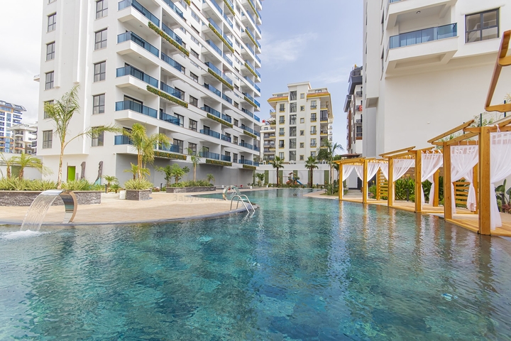 Сучасна квартира 1 + 1 в новому комплексі з басейном і спа-зоною в Махмутларі