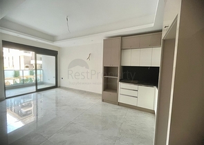 Сучасна квартира 1 + 1 в новому комплексі з басейном і спа-зоною в Махмутларі