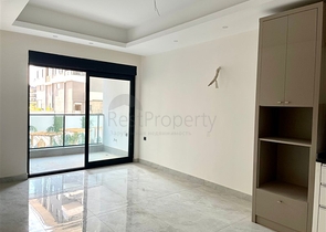 Сучасна квартира 1 + 1 в новому комплексі з басейном і спа-зоною в Махмутларі