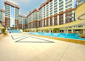 Простора квартира з сучасним дизайном в Махмутларі