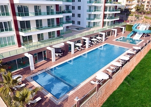 Затишна квартира 2 + 1 в сучасному житловому комплексі Тосмура